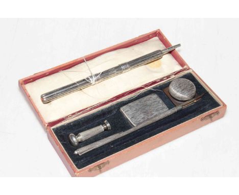 Boxed silver (unmarked) desk set with inkwell, pen, etc, along with propelling instrument (2).