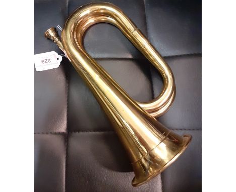 A 20th Century brass bugle, 27cm high. Location:1.1 