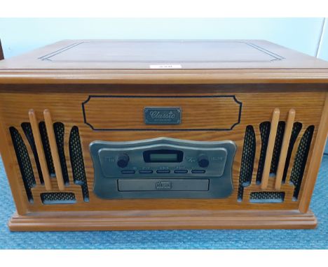 A 'Classic Collectors Design' reproduction music centre in an oak case, Model No:9809. Location:1.4 