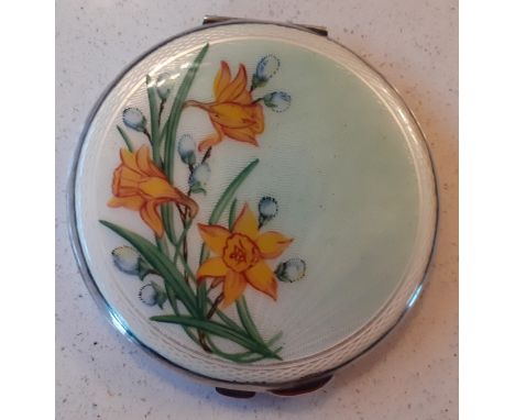 A 1960's/70's Birmingham white metal and enamelled compact with yellow daffodil design to the lid, makers mark JG Ltd (J Glos