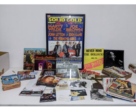 A selection of music memorabilia to include an autographed poster of the Solid Gold Rock and Roll Show '97 with programme and