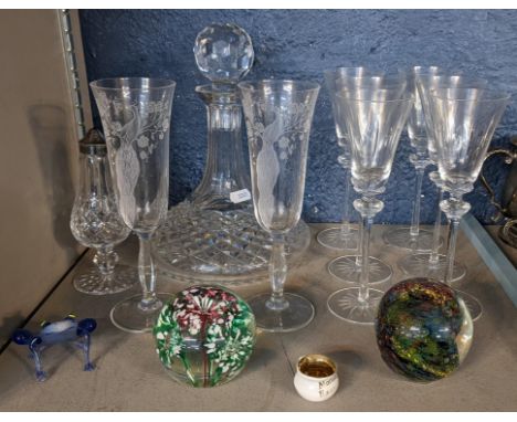 A selection of glassware to include a cut glass ship's decanter, set of six cut small wine glasses, Avondale paperweight, and