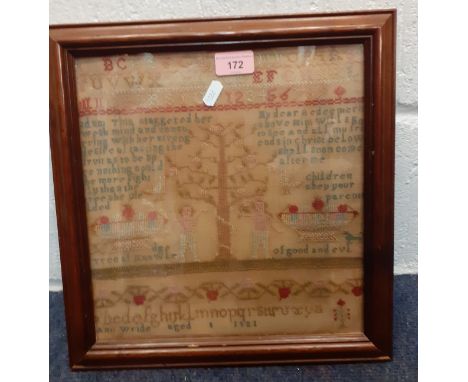 An 1821 framed and stretched sampler worked by Ann Wride, the centre being the tree of knowledge having a snake wrapped aroun