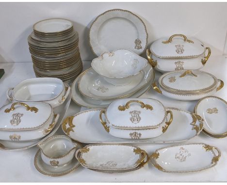 An early 20th century Limoges dinner service, some signed to the base, Theodore Haviland, the others signed R Delinieres, spa