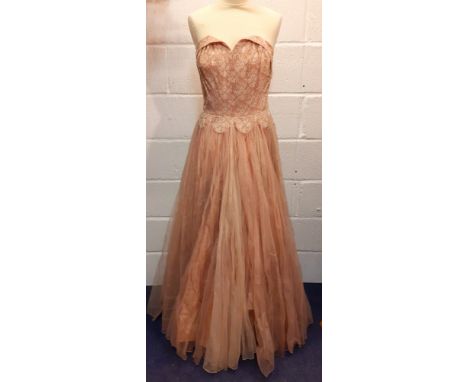 A 1930/40's Olga Osllund, Stockholm machine and hand-sewn strapless evening dress in dusty pink having a taffeta and netted s
