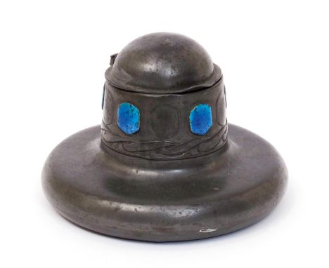 A Liberty & Co Tudric pewter and enamel inkwell designed by Archibald Knox, model no.0164, with hinged cover,  cast in low re
