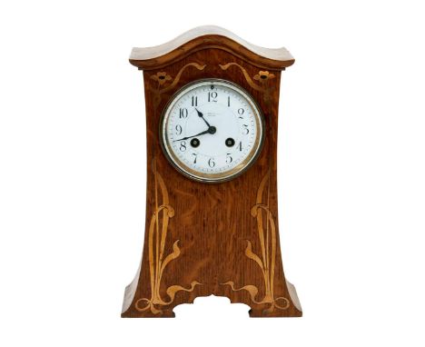 An Arts and Crafts inlaid oak mantel clock, tapering, rectangular form with swollen, overhanging mantel, inlaid to the front 