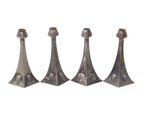 Four W.M.F Secessionist candlesticks designed by Albin Muller,  each on diamond shaped foot, cast in low relief with foliate 