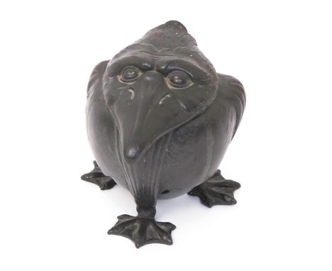 A Continental Art Nouveau inkwell modelled as a grotesque bird, possibly Orivit, the hinged cover modelled as his head, with 