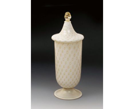 A Murano glass urn and cover, white glass with aventurine decoration, cased in clear, the cover with twisted glass finial,  a