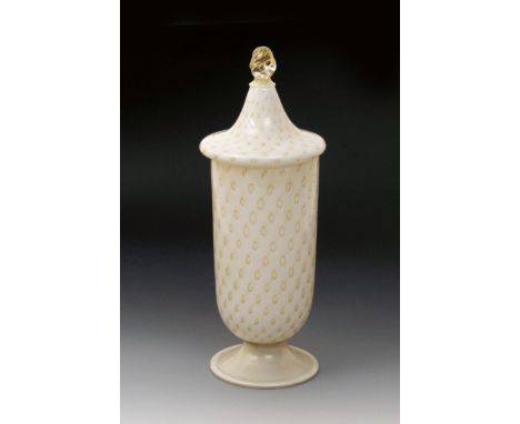 A Murano glass urn and cover, white glass with aventurine decoration, cased in clear, the cover with twisted glass finial,  a