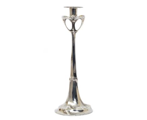 A tall Kayserzinn polished pewter candlestick, amorphic form, with flaring drip pan and sconce, cast mark, 42cm. high