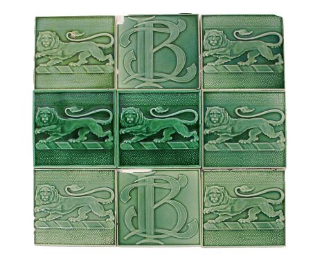 Sixteen Pilkington's Lancastrian tiles each modelled with a lion Passant, glazed green, another two Pilkington's Lancastrian 
