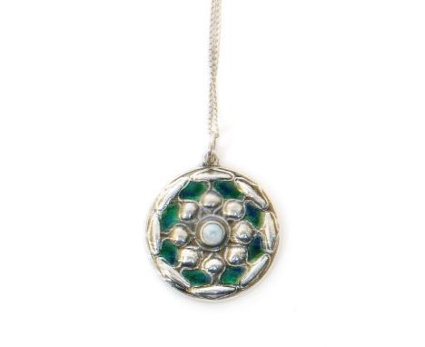 A Liberty & Co Cymric silver and enamel pendant, circular cast in low relief with stylised flowerhead, set with abalone shell