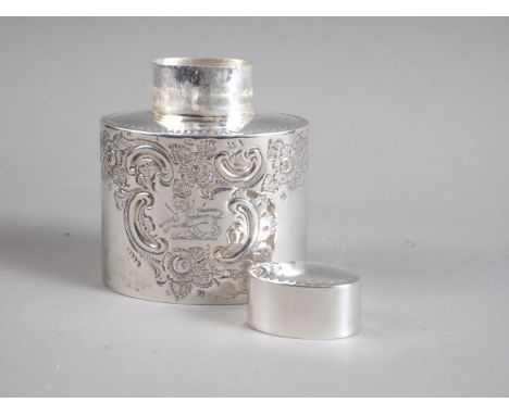 An oval silver tea caddy with engraved and embossed decoration, 2.2oz troy approx 