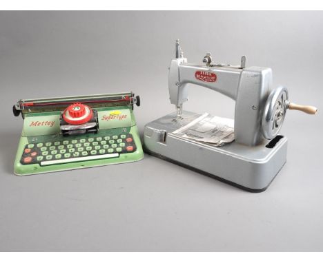 An Essex Miniature Sewing Machine and a Mettoy tin-plated "Supertype" toy typewriter 