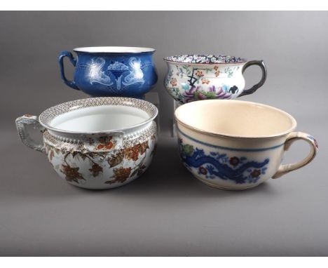 A Spode "Italian" chamber pot, a vine decorated chamber pot, a dragon decorated chamber pot and two other chamber pots 