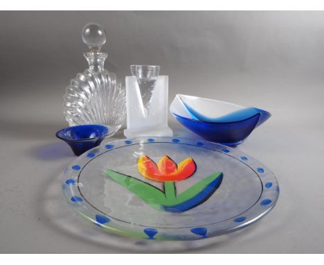 A Mats Jonasson blue glass bowl, a similar companion bowl and a Kosta Boda enamelled plate by Uhutef, 15" dia, a Kosta Boda c