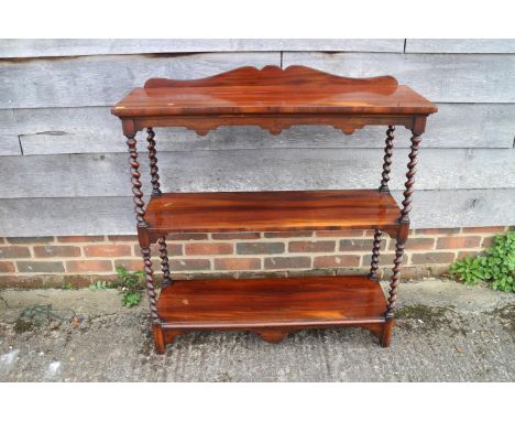 A 19th century rosewood three-tier whatnot, 36" wide x 12" deep x 36" highThe shelves are solid rosewood.There's a stamp on t