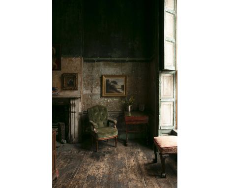 A GEORGE IV BUTTON BACK OPEN ARMCHAIR, with arched back upholstered in green velvet material, raised on turned fluted legs. 1