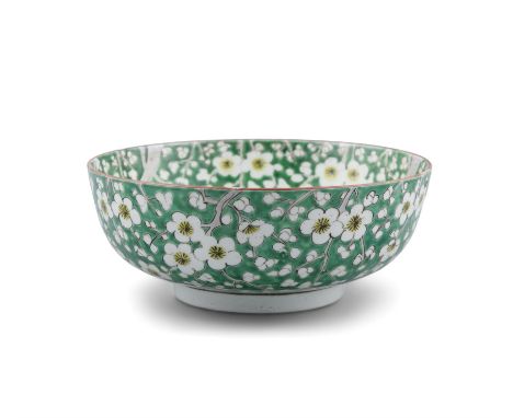 A CHINESE 19TH CENTURY PRUNUS PATTERN BOWL, painted in green and yellow enamels with four- character mark to the base. 24cm d