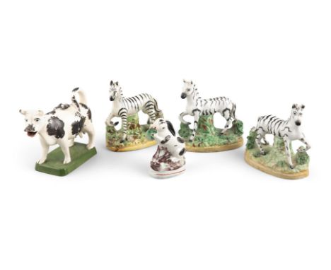 A COLLECTION OF THREE STAFFORDSHIRE POTTERY MODELS OF ZEBRAS, an early spunge-ware cow creaners and lid, and a small model of