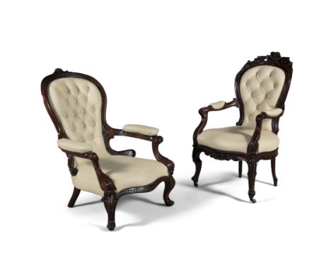 TWO VICTORIAN MAHOGANY FRAMED LADY'S AND GENTLEMAN'S ARMCHAIRS, the button back, seats and arms upholstered in cream leather,