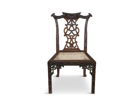 A MAHOGANY CHINESE CHIPPENDALE SIDE CHAIR, with carved leaf and ribbon splat, inset canework seat and raised on blind fret de