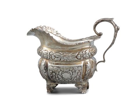 A GEORGE IV IRISH SILVER CREAM JUG, Dublin c.1826, lacking maker's mark, of shaped rectangular form, with cast gadroon and fo