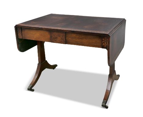 A REGENCY ROSEWOOD AND MARQUETRY INLAID SOFA TABLE, the rectangular top with twin drop leaves, rounded corners over two short