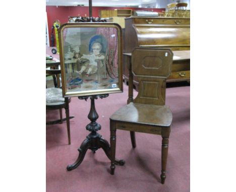 A XIX Century Mahogany Pole Screen, with a tapestry panel of a turned pedestal on cabriole legs, scroll feet.
