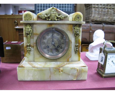 A Circa 1900 Onyx Mantel Clock, of architectural form, brass circular dial, Arabic numerals and brass appliques to the pedime