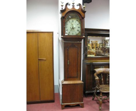 A George III Oak and Mahogany Crossbanded Longcase Clock, painted squared dial with painted spandrels and arched scene of gra