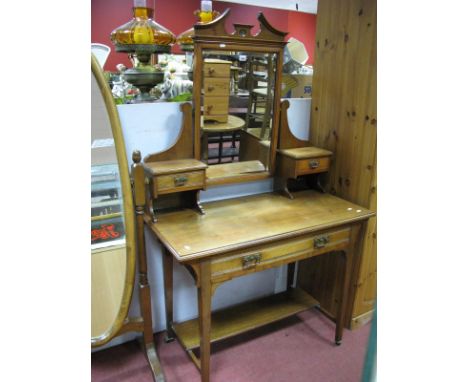 Early XX Century Walnut Dressing Table, with swing mirror, twin jewel drawers oval single drawer on tapering legs, united by 