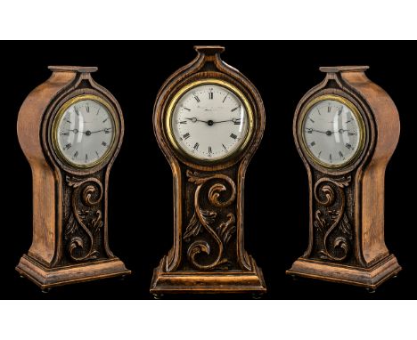 Art Nouveau Carved Oak Mantel Clock in a shaped, floral case, with a white enamel dial; Ferranti, Manchester, c 1900; 11 inch