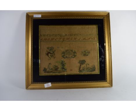 Mid-19th century sampler in gilt frame on black background, the sampler indistinctly signed, with alphabet and embroidered sc