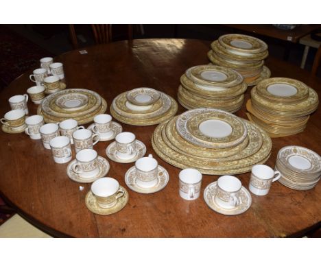 Extensive quantity of Royal Worcester dinner wares with gilt scroll design mainly in the Embassy pattern, together with 12 so