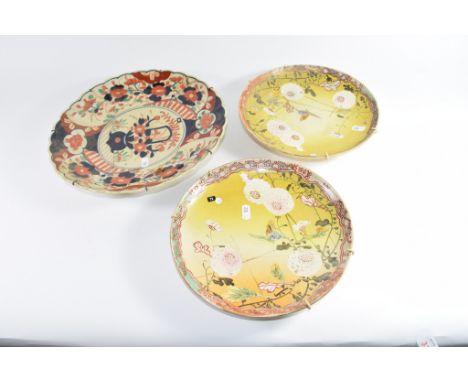 Pair of Japanese Satsuma ware plates with floral decoration and a further Imari style dish (3)