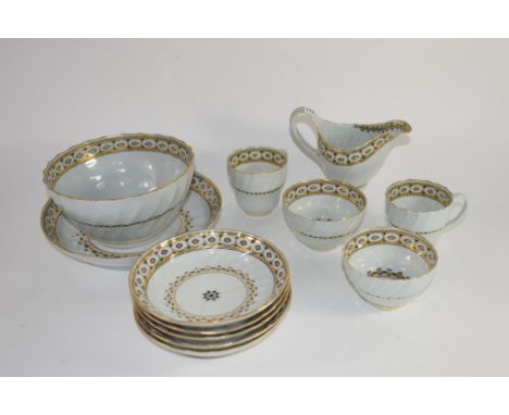 Group of late 18th century tea wares, probably Worcester, comprising 2 cups, 2 tea bowls, saucers, helmet shaped milk jug, sl