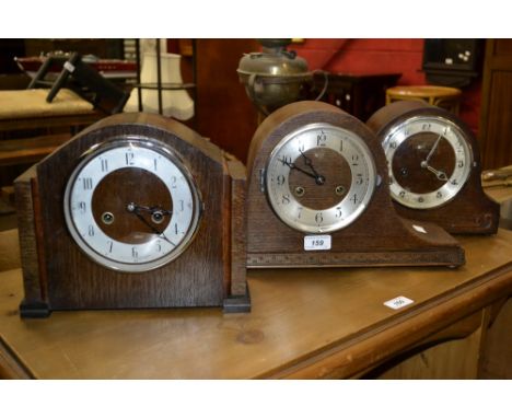 An early 20th century oak Enfield bracket clock, Arabic numerals, square feet, c.1930; another similar; a conforming Napoleon