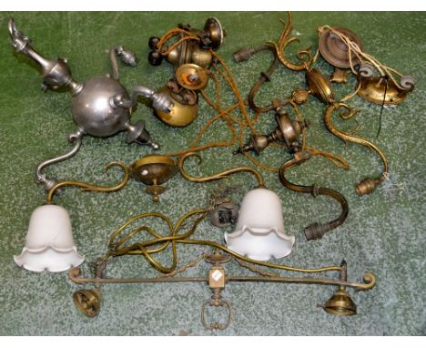 An early 20th century gilt brass S-scroll wall sconce, c.1920; a 20th  century three-branch ceiling light; etc 