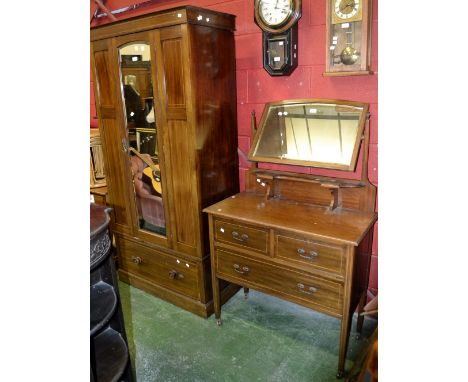 An Edwardian mahogany two piece bedroom suite comprising single wardrobe, central arched mirrored door, deep drawer to base, 