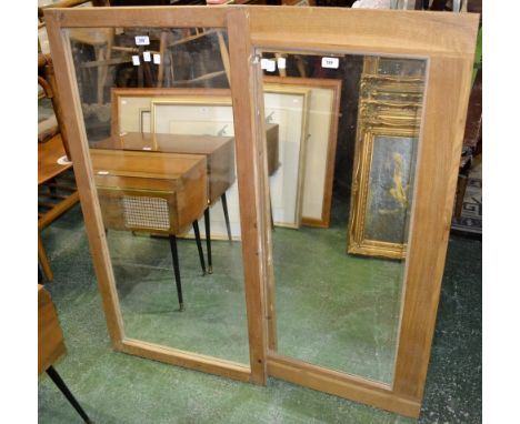 An oak wall mirror and a pine wall mirror 