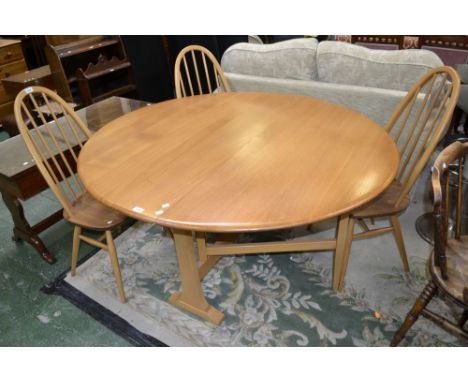 An Ercol light elm dropleaf table and four chairs (5)