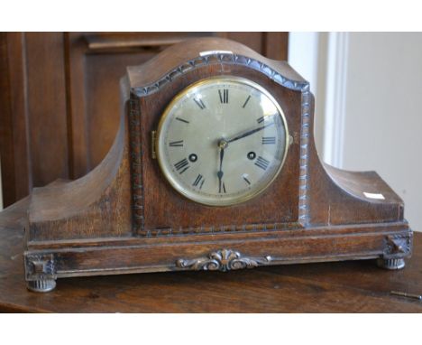 A large oak two keyhole chiming mantel clock
