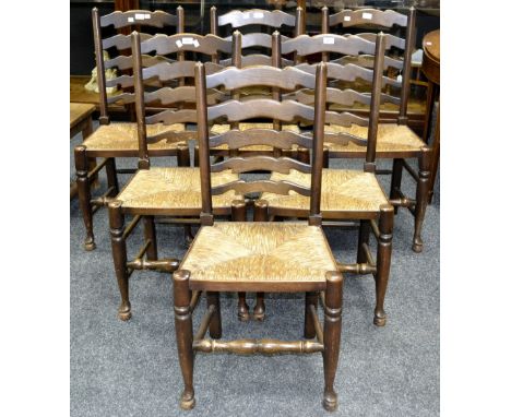 Six ladder back dining chairs, raffia seats, turned forelegs.