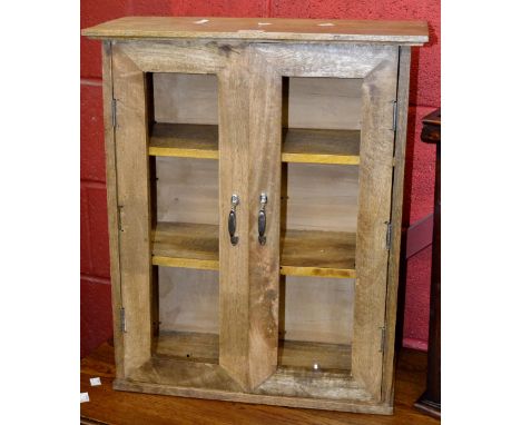 A wall hanging two door cupboard, two shelf interior