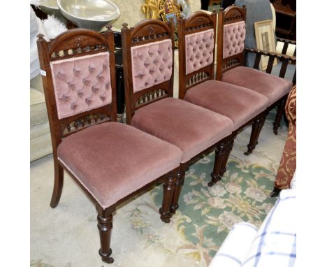 A set of four Victorian mahogany dining chairs, carved throughout, ceramic casters, c.1860