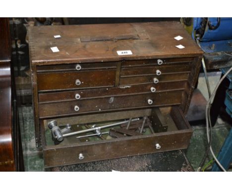 An engineer's toolbox with assorted tools.