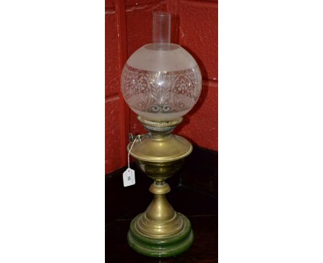 A Victorian oil lamp, with etched glass globe